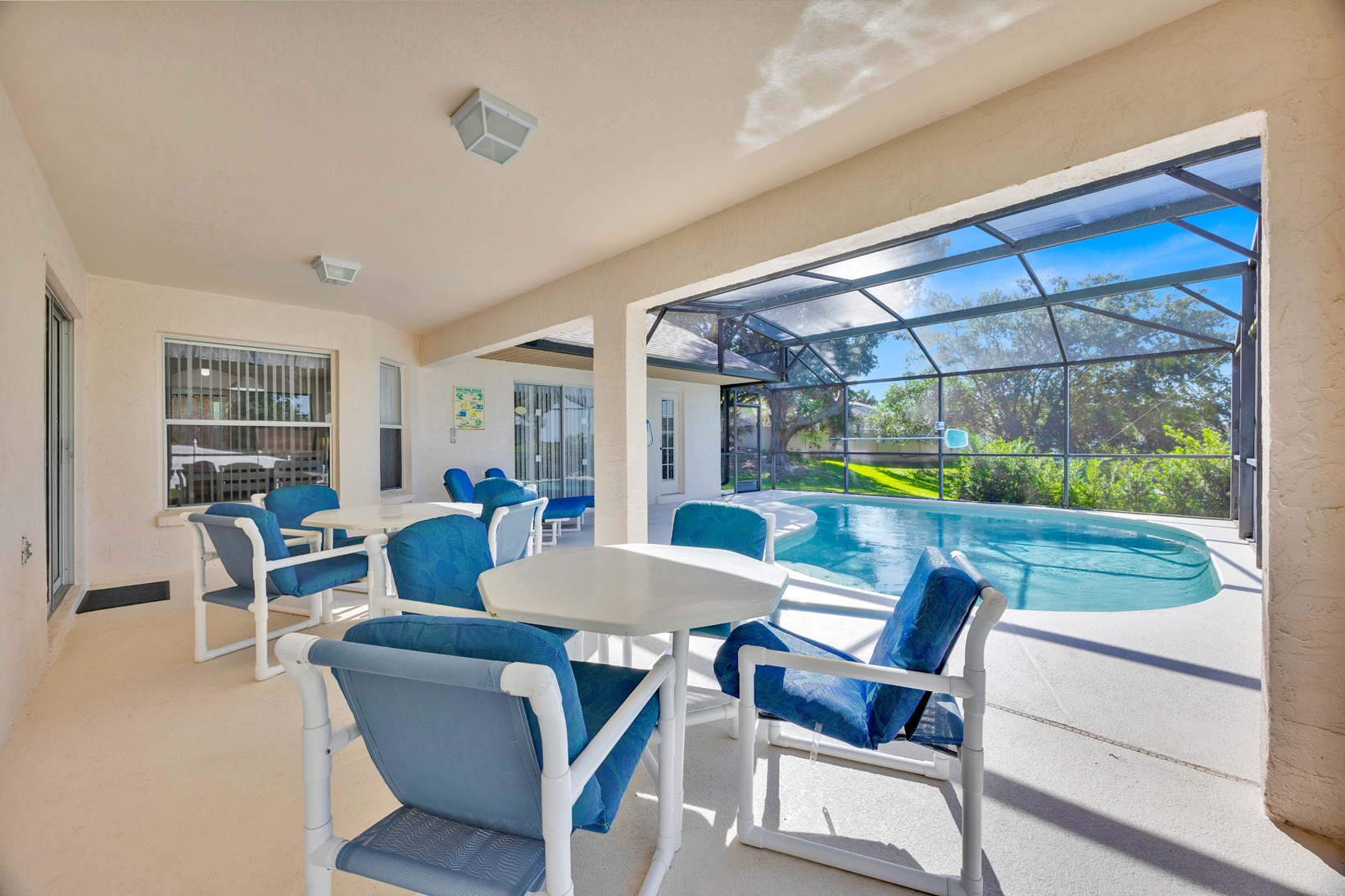 Poolside sun loungers and patio space