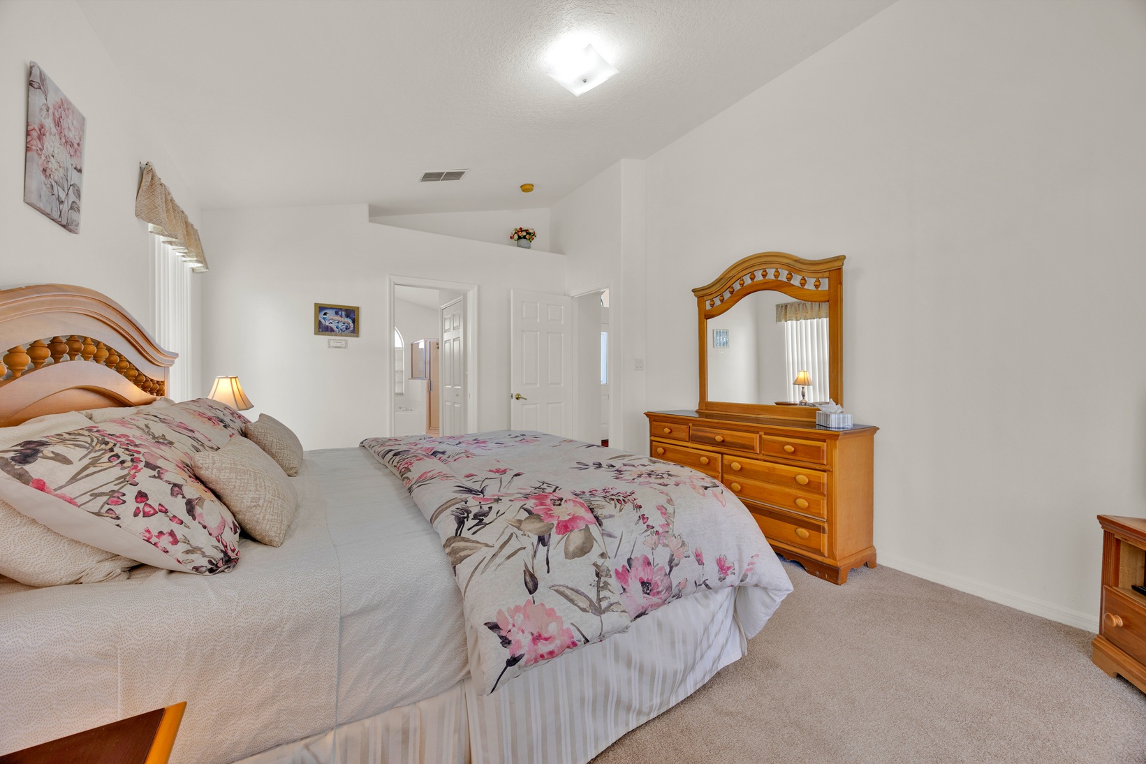 Master suite with luxury bedding and ample storage