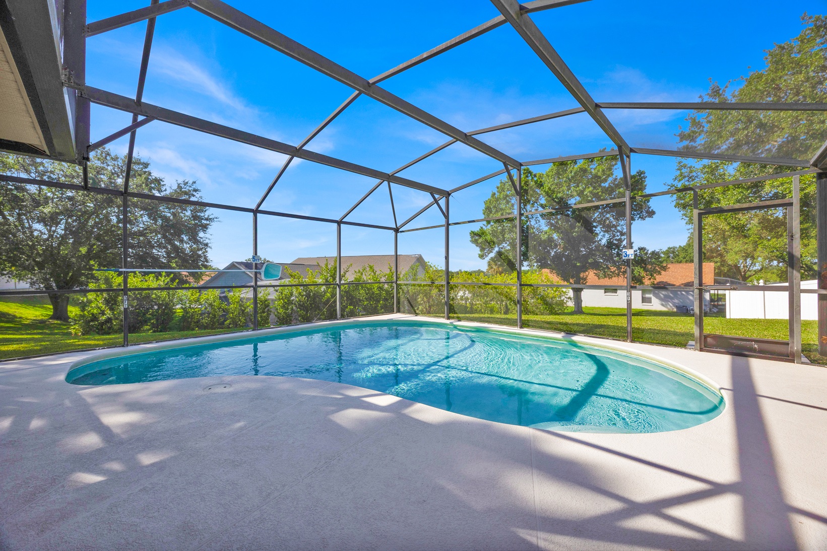 Sunny pool deck view at our Orlando vacation rental