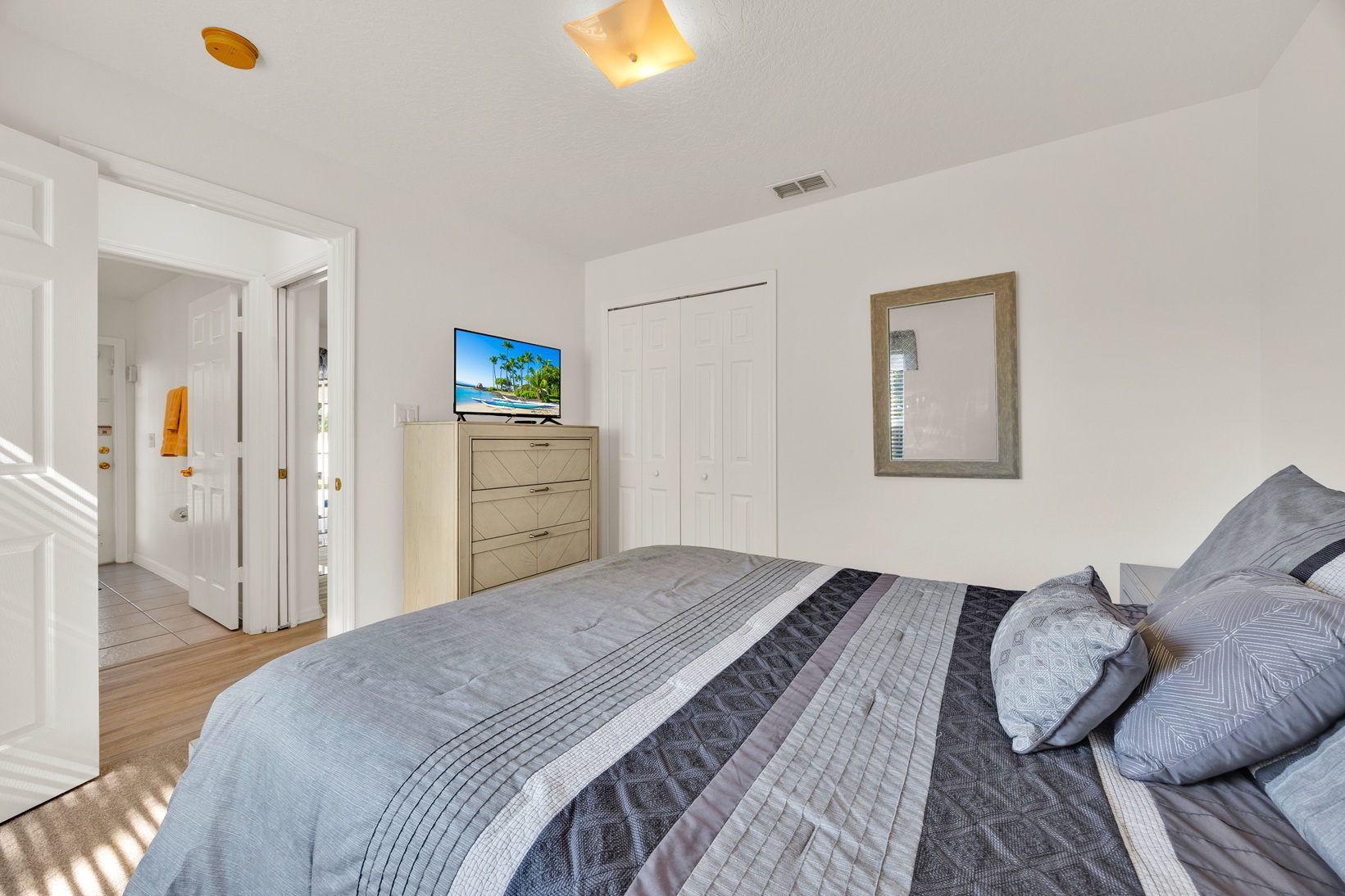 Brightly decorated queen guest room