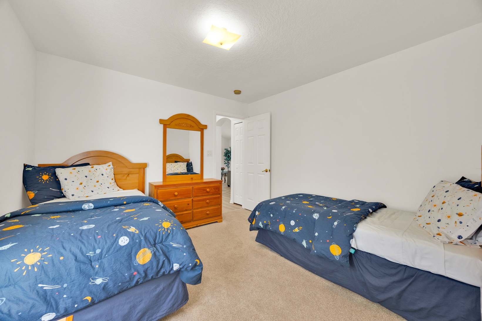 Space-themed twin beds with custom decor